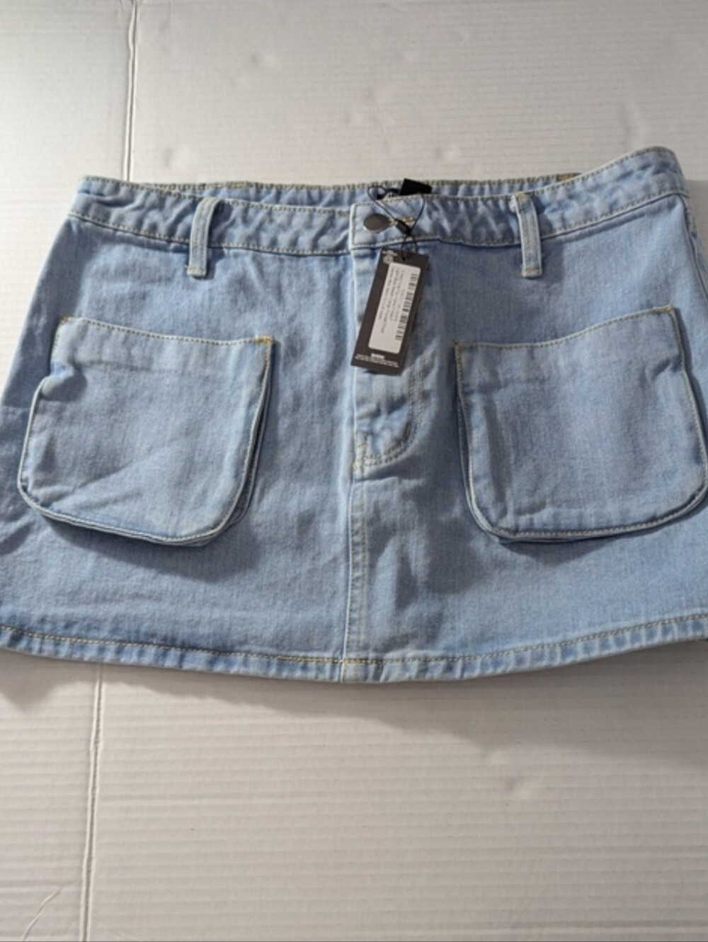 PrettyLittleThing Light Blue Wash Cargo Pocket Front Denim Mini Skirt